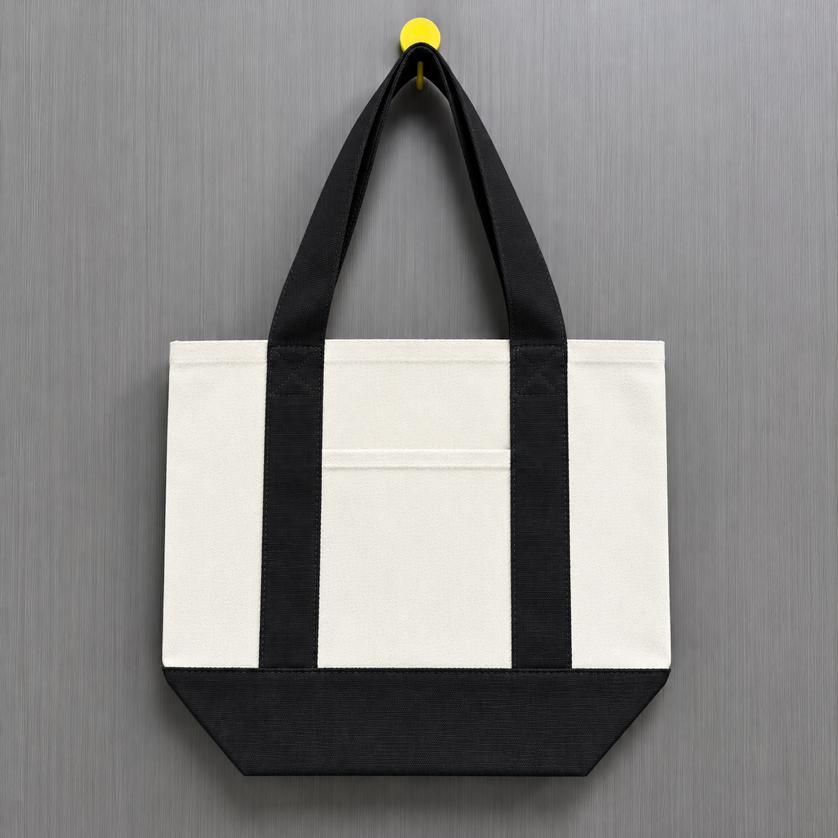 Black color block mini canvas tote bag with natural canvas body, black contrast handles and matching bottom panel.