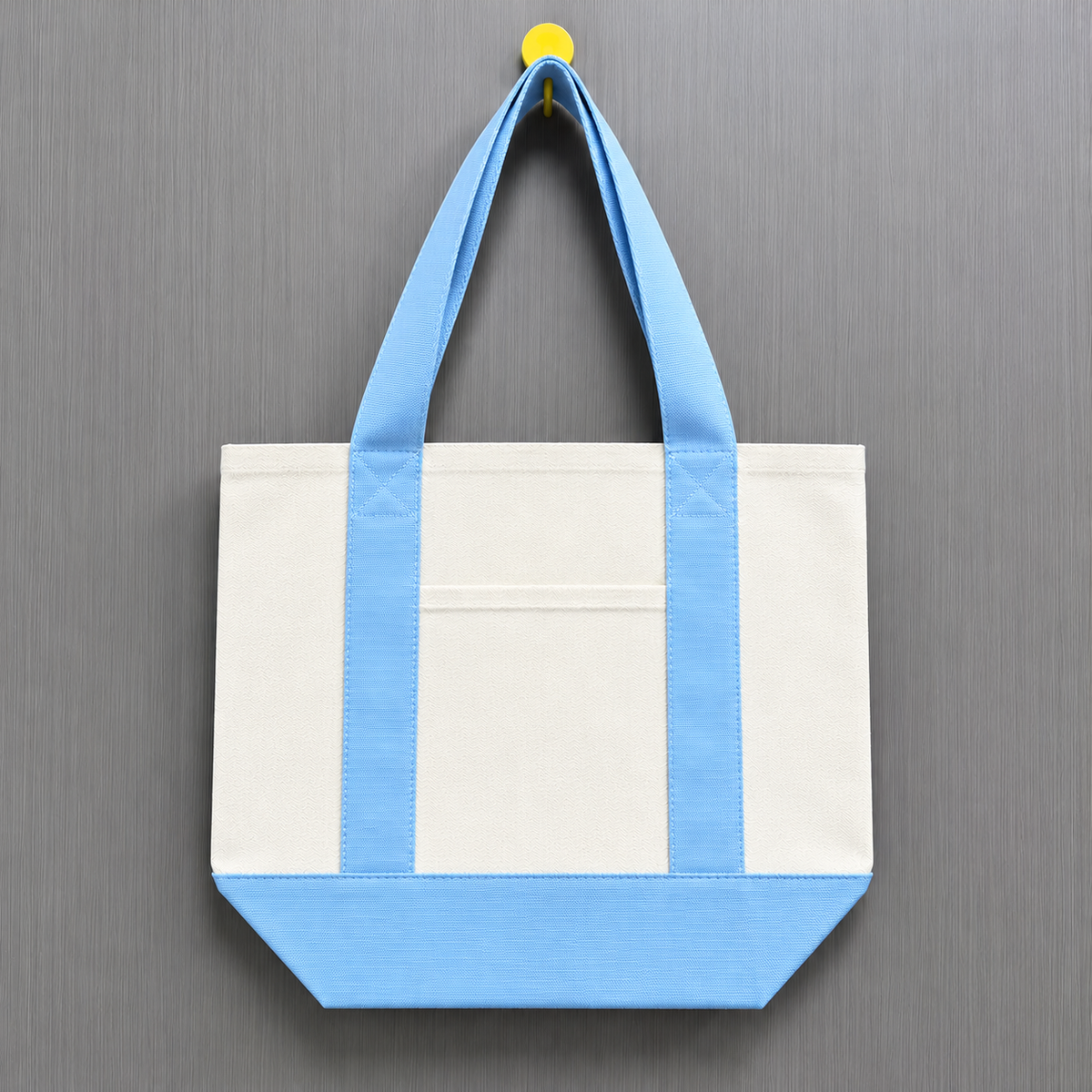 Light blue color block mini canvas tote bag featuring a natural canvas body with pastel blue handles and matching bottom panel.
