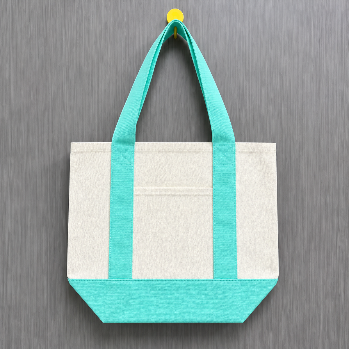Mint green color block mini canvas tote bag with natural canvas body, mint green handles and matching bottom panel.