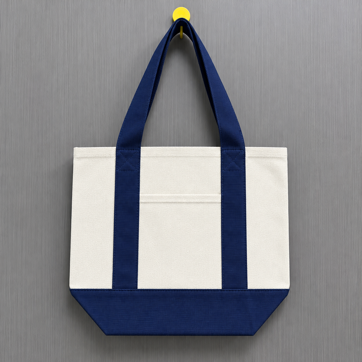Navy blue color block mini canvas tote bag with natural canvas body, dark blue handles and matching bottom panel.