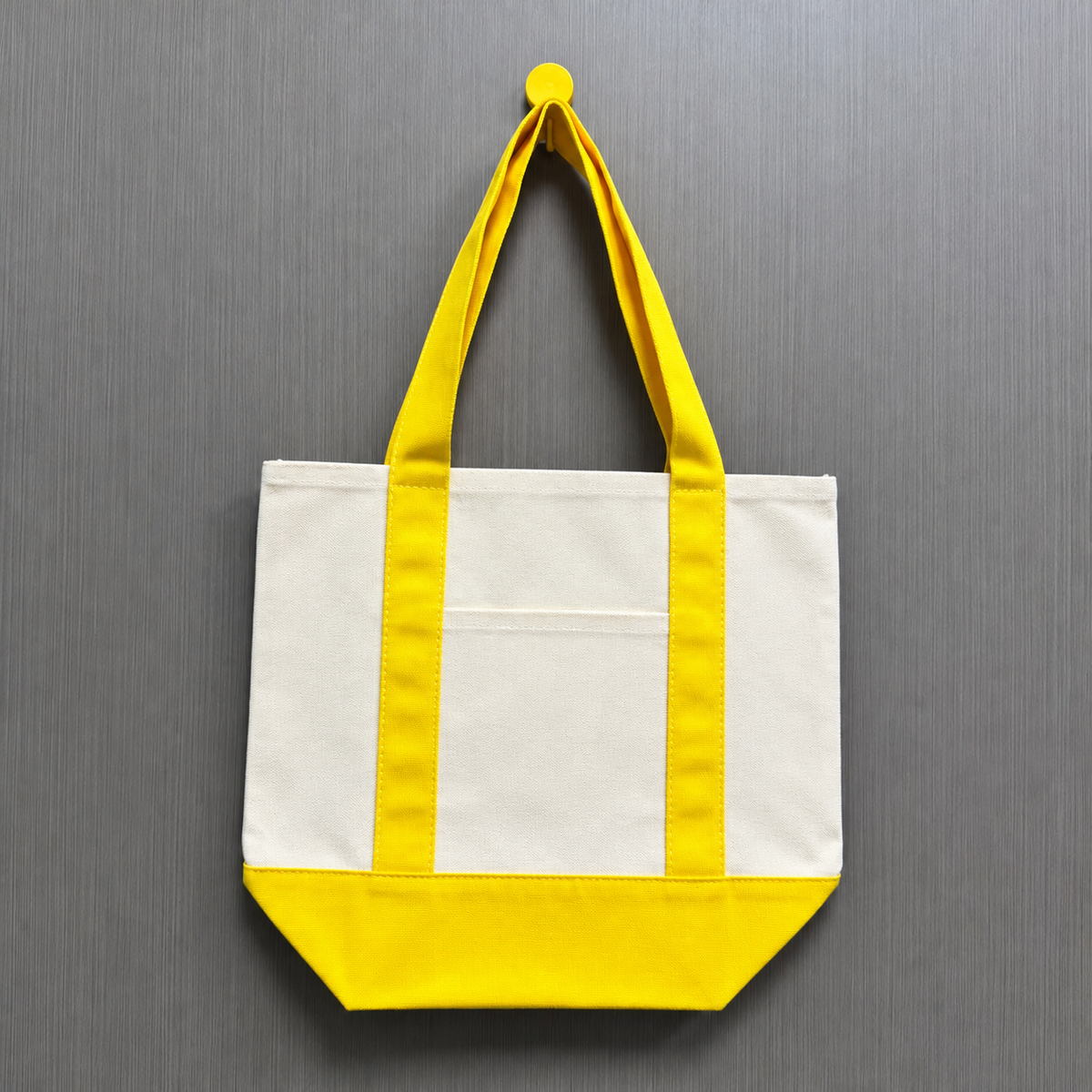 Yellow color block mini canvas tote bag with natural poly-cotton canvas body, yellow handles and matching bottom panel, ready for DIY decoration.